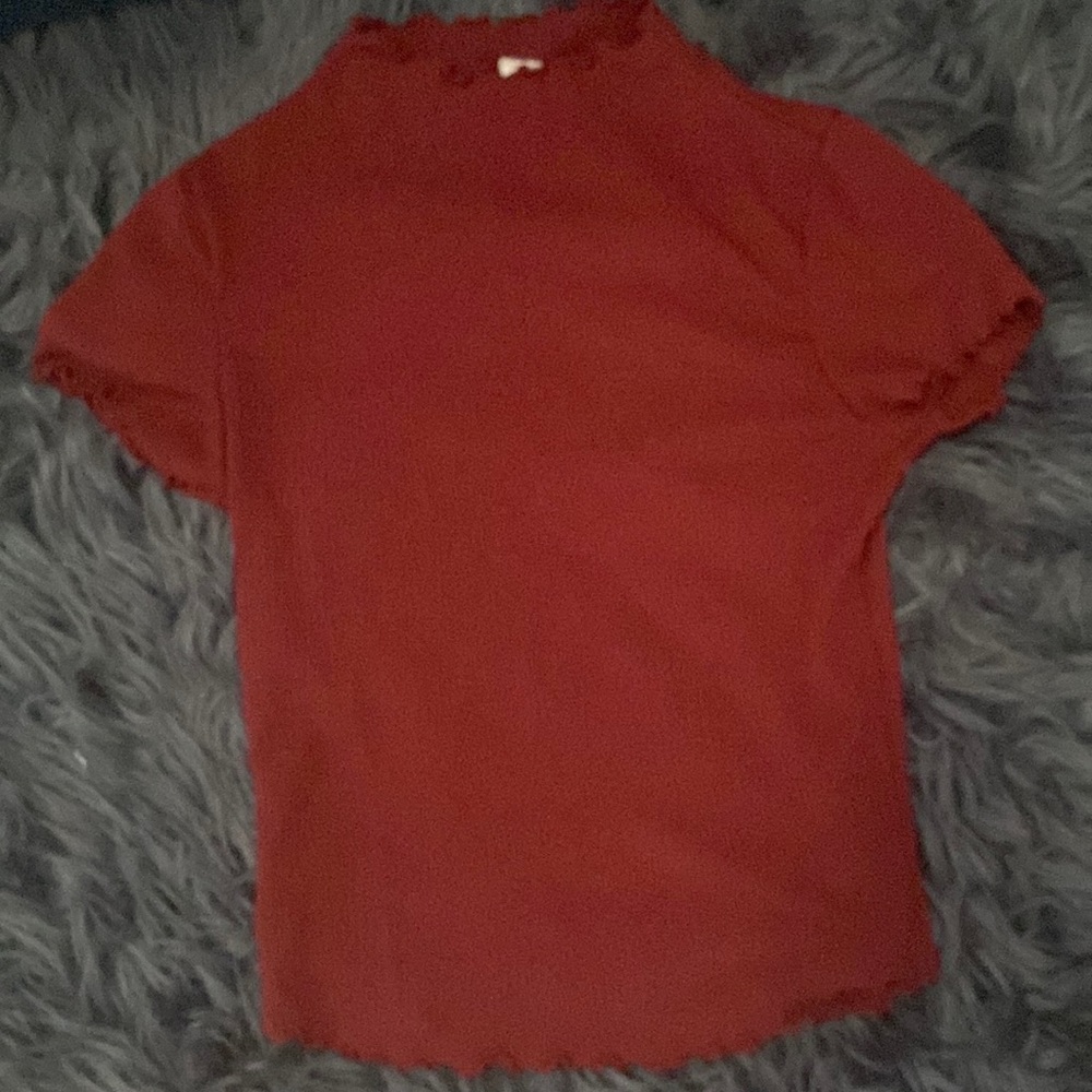 I am selling a burgundy ribbed shirt from Tillys.